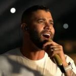 Gusttavo Lima promete doação de meio milhão para famílias de lixão que não existe